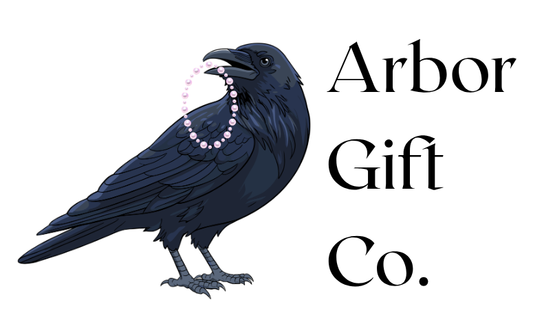 arbor gift co heading plus crow with pink beaded bracelet in its beak